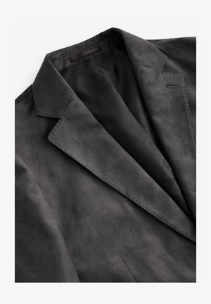 Grauer Blazer mit einer glatten, matten Textur. Mit Reverskragen und einem Innenfutter ausgestattet. Minimalistisches Design ohne Verzierungen.