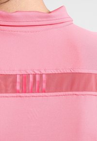 K-SWISS Sportovní tričko - coral