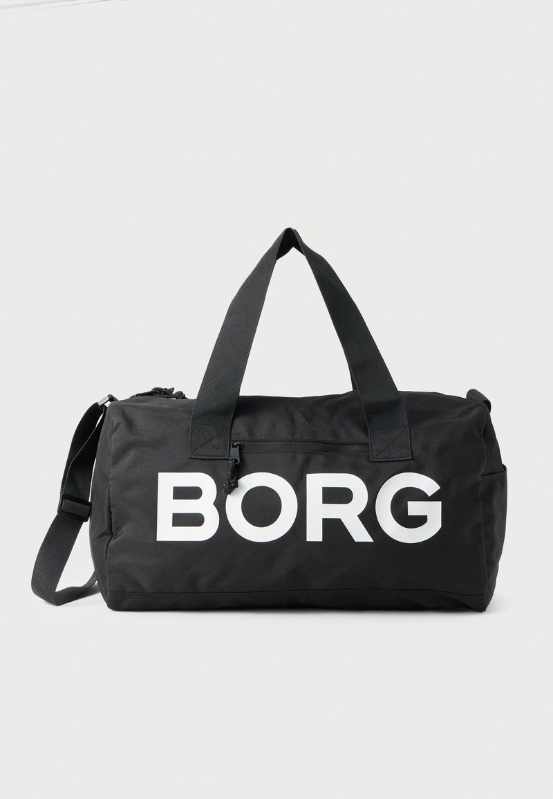 Črn potovalni nahrbtnik z belim logotipom "BORG". Ima dvojne ročaje in nastavljiv ramenski pas. Gladka, trpežna tkanina z zadrgo.
