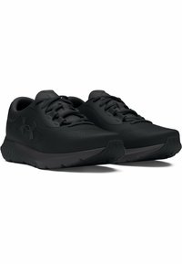 Chaussures de sport noires avec un dessus texturé, bout rond et lacets à l'avant. Elles possèdent une semelle en caoutchouc avec des motifs d'adhérence et un talon rembourré.