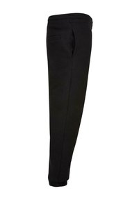 Pantalon de survêtement noir fuselé avec ceinture élastique et poignets aux chevilles, comprenant des poches fendues latérales et arrière.