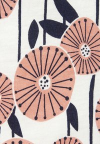 Floral fabric featuring stylized pink flowers with black lines on a cream background, accentuated by green leaves and simple stems.