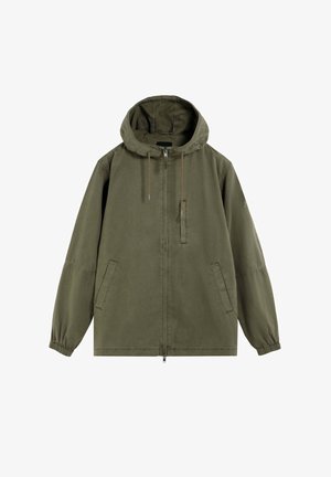 Grüne Kapuzenjacke mit Frontreißverschluss, zwei Seitentaschen, elastischen Bündchen und einer Reißverschlusstasche auf der Brust.