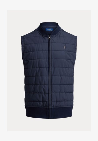 Veste matelassée bleu marine avec sections matelassées, col montant, fermeture éclair avant et petit logo brodé sur la poitrine.