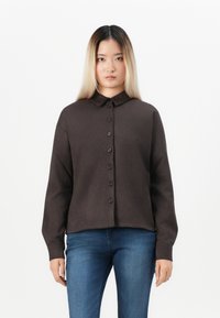 Dark brown button-up shirt featuring a collar, long sleeves, and a relaxed fit, made from a smooth fabric with a soft texture.
