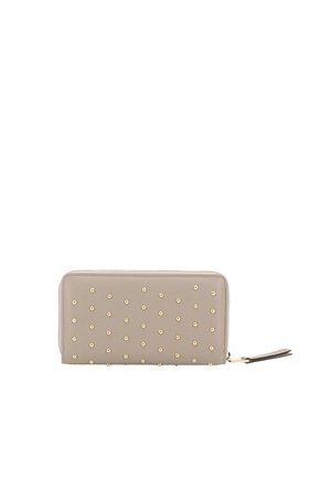Beige leather wallet with gold stud accents, zip closure, and wrist strap. Smooth texture, rectangular shape, and organized interior.