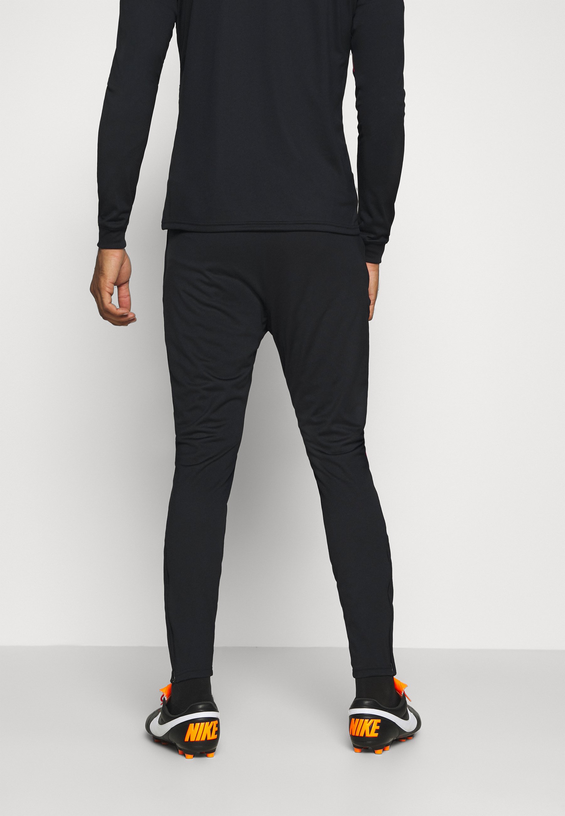 pink and black nike tracksuit