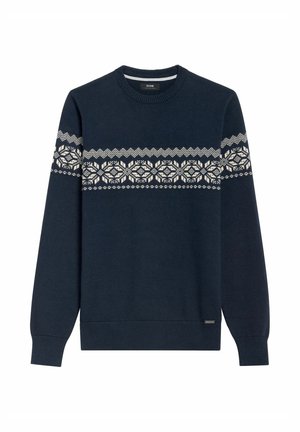 Granatowy sweter z dzianiny z białym geometrycznym wzorem na klatce piersiowej. Posiada okrągły dekolt i długie rękawy.