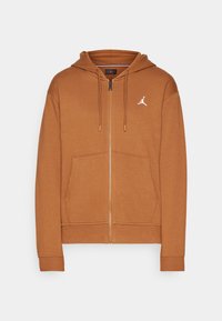 Felpa con zip marrone, dotata di cappuccio con cordino, tasche frontali, polsini a costine e logo Jordan bianco sul lato sinistro del petto. Materiale morbido in misto cotone.