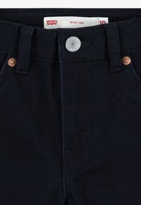 Levi's® WIDE LEG - Traperice krojene za nošenje s čizmama - black
