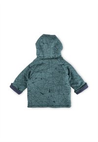 Giacca a cappuccio blu-verde con un motivo geometrico nero. Presenta polsini a contrasto blu scuro e una texture morbida. Adatta per essere indossata a strati.