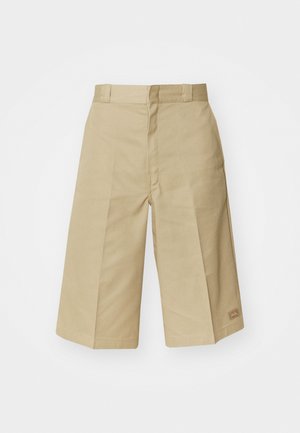 Beige bomullsculotter med skräddarsydd design, som har hög midja, plisseringar och synliga sömmar. Inkluderar en liten logotyp på fållen.