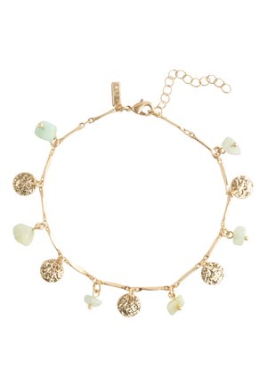 Delicate gold chain bracelet with alternating small textured gold discs and pale green stone charms, secured by a lobster clasp.