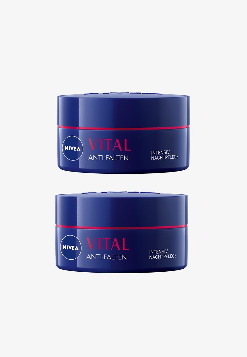 Two blue cream jars stacked, each labeled "NIVEA VITAL ANTI-FALTEN," with red accents. Text on jars in white and red, indicating night use.