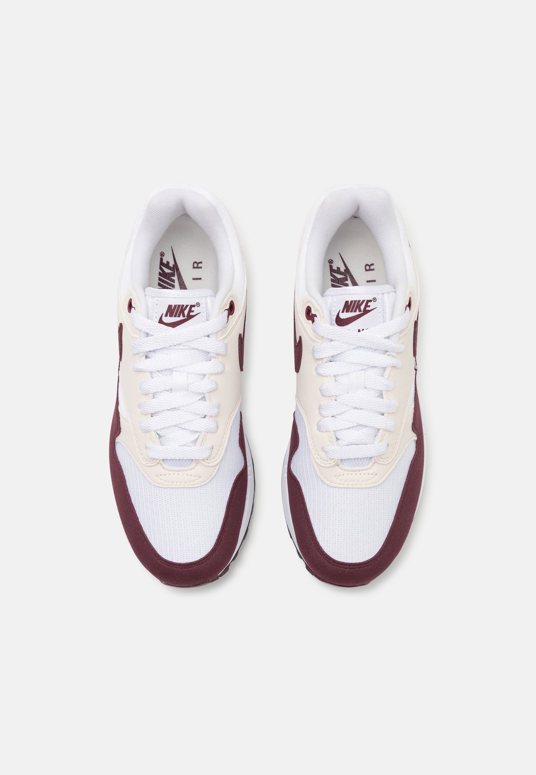 white and maroon nike shoes
