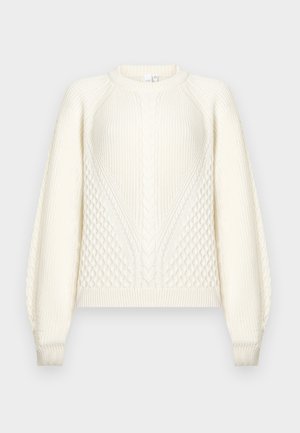 Cream knit sweater with cable and honeycomb patterns, long sleeves, ribbed cuffs, and crew neckline on a neutral background.