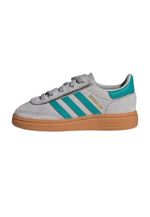 Grey suede Adidas Spezial sneaker with teal stripes, teal heel tab, gold lettering, and a gum rubber sole.