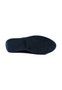 Suola in gomma nera con un motivo strutturato per la trazione, con il logo del marchio integrato vicino al tallone e un design dai bordi lisci.