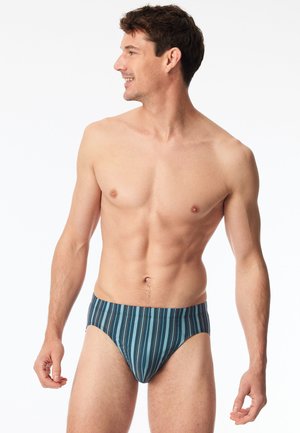 Herren-Schwimmbreifs in dunkeltürkis mit vertikalen Streifen in verschiedenen Farben. Verfügt über einen weichen, elastischen Bund und einen glatten, leichten Stoff.
