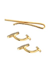 Goldfarbene Haaraccessoires, die ein Haarnadel und zwei Clip-ohrringe mit strukturierten, kreisförmigen Designs und glatten, gebogenen Formen umfassen.
