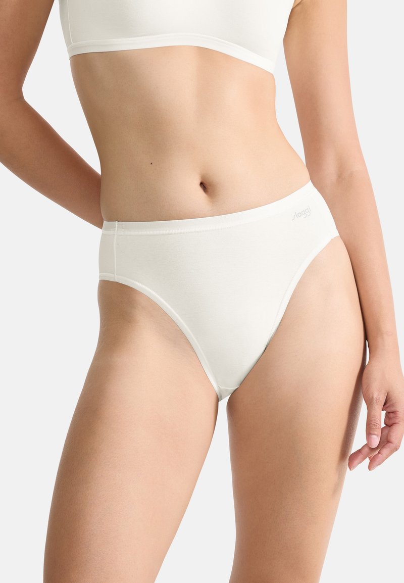 White cotton brief with a smooth texture, high-cut leg openings, and minimalistic design. Features a subtle logo on the waistband.
