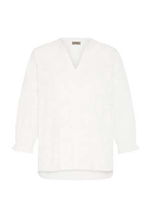 Balta ilgomis rankovėmis palaidinė su V formos iškirpte ir subtiliu gėlių siuvinėjimu, elastinės rankogaliai su volanu ir šiek tiek suapvalintas apatinis kraštas.