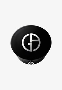 Conteneur cosmétique rond noir avec une finition brillante, présentant un design de logo argenté proéminent sur le dessus et un accent argenté à la base.