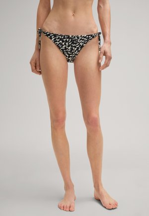 Zwart-wit gestreepte bikini onderkant met verstelbare zijknoopjes en metalen accenten. Heeft een low-rise snit en een gladde stoftextuur.
