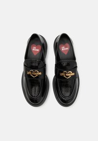 Love Moschino NEW CITY LOVE - Jalga libistatavad jalanõud - nero