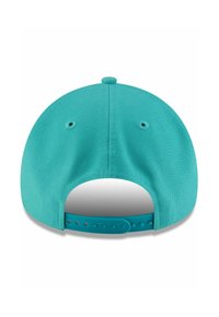 Turquoise baseball cap with textured fabric, a rounded shape, and a snap closure at the back, featuring ventilation holes.