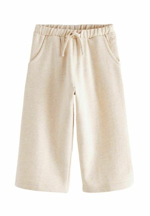 Beige gestrickte Shorts mit elastischem Bund, Kordelzug und seitlichen Taschen, abgebildet vor weißem Hintergrund.