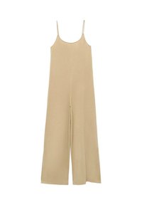 Salopette beige con spalline sottili, vestibilità ampia, gambe larghe e una texture morbida. Presenta una leggera fessura frontale per facilitare i movimenti.