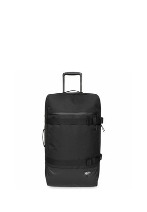 Schwarzer Rucksack mit Rollen, aus strapazierfähigem Material, mit ausziehbarem Griff, oberem Reißverschluss, verstellbaren Trägern und glänzenden Akzenten.