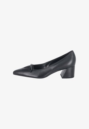 Zapato de salón de mujer en piel negra con puntera puntiaguda, tacón grueso de altura media y pequeño lazo decorativo en la parte delantera.