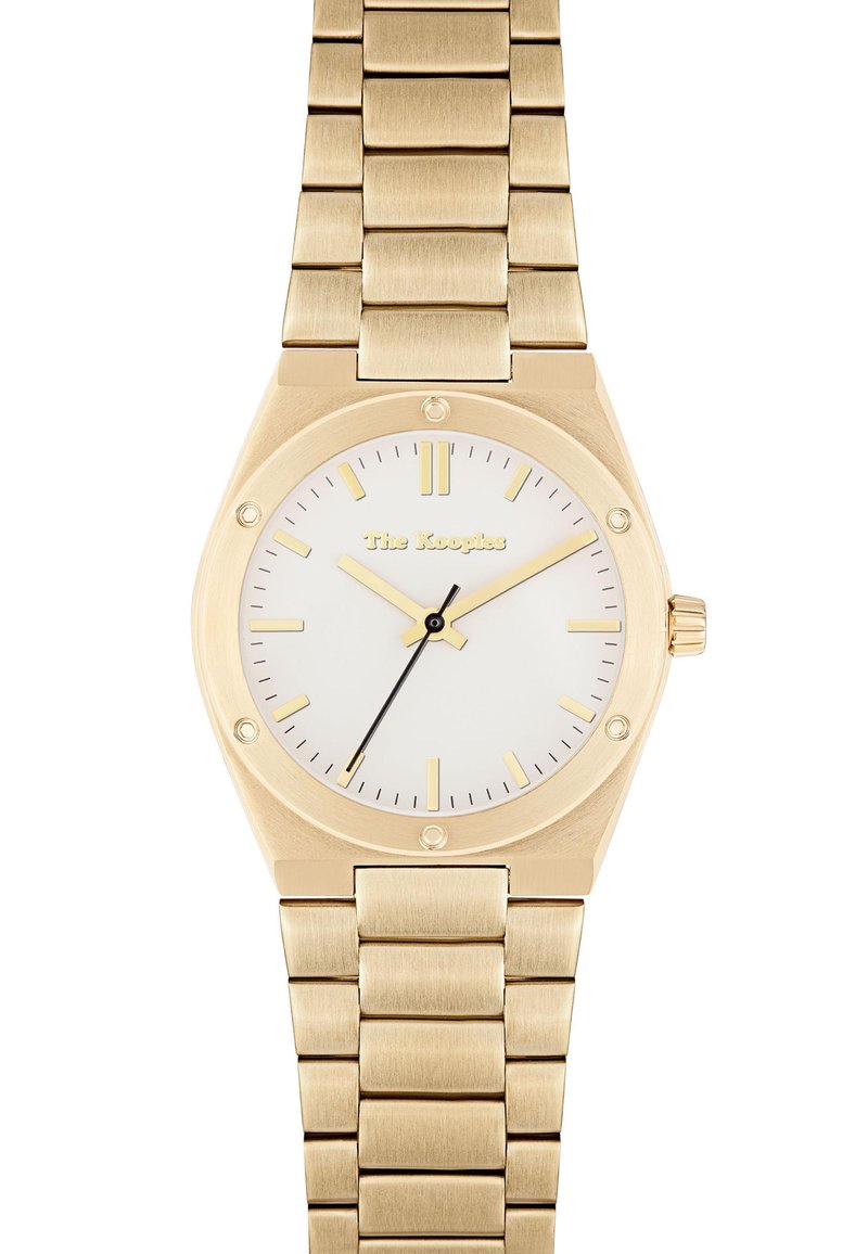 Guldtonet armbåndsur med hvid urskive, minimalistisk design, oktagonal kasse og et armbånd i rustfrit stål med børstede led.