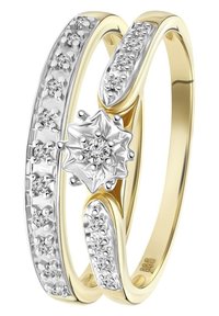 Goud- en zilveren ring met een centraal bloemontwerp, versierd met sprankelende diamanten en een gepolijste afwerking. Gebogen banden met afwisselende texturen.