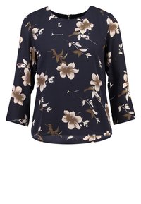 Floral blouse with three-quarter sleeves. Dark navy background with light tan and white flowers. Soft fabric, round neckline, slightly curved hem.
