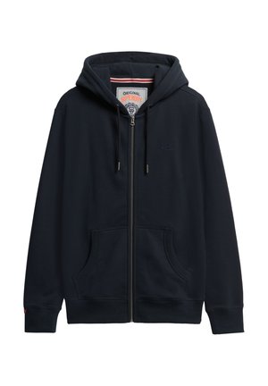 Navy zip-up hoodie made from soft fabric, featuring a drawstring hood, two front pockets, and ribbed cuffs, with branding on the chest.