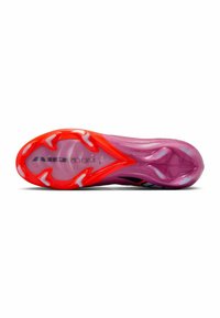 Sole di una scarpa sportiva rosa e rossa con materiale traslucido e testo "AIR ZOOM" visibile sulla piastra inferiore.