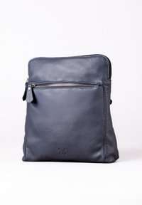 Dark blue leather bag with a smooth texture, vertical zippered front pocket, and subtle logo embossed at the bottom. Square shape.