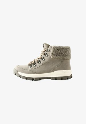 Gray suede hiking boot with a fluffy gray collar, metal eyelets, and beige laces. Rugged rubber sole with a textured pattern for grip.