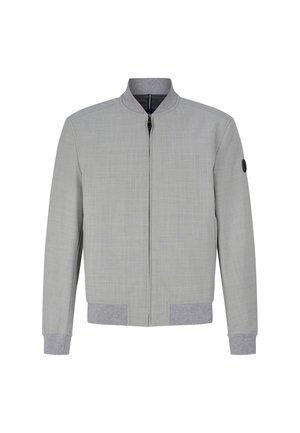 Veste bomber grise avec une finition texturée, zip noir, et poignets et ourlet en côte gris. Présente un logo rond noir sur la manche gauche.