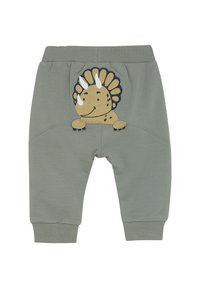 Groene katoenen sweatpants met geribbelde boorden. Heeft een gele en blauwe geborduurde dinosaurusontwerp op de achterkant.