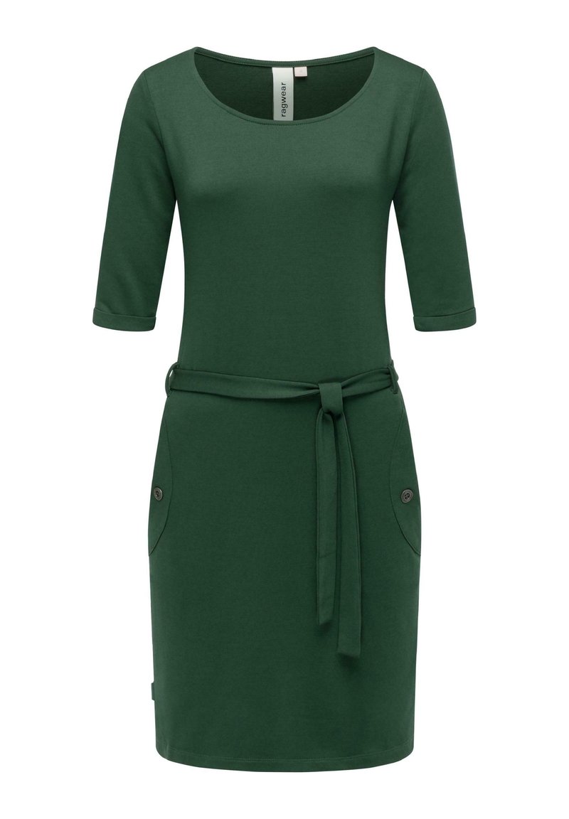 Vihreä mekko pehmeästä kankaasta, jossa on kolme neljäsosaa hihat, pyöreä kaula-aukko, sidottava vyö ja kaksi sivutaskua nappikoruilla.