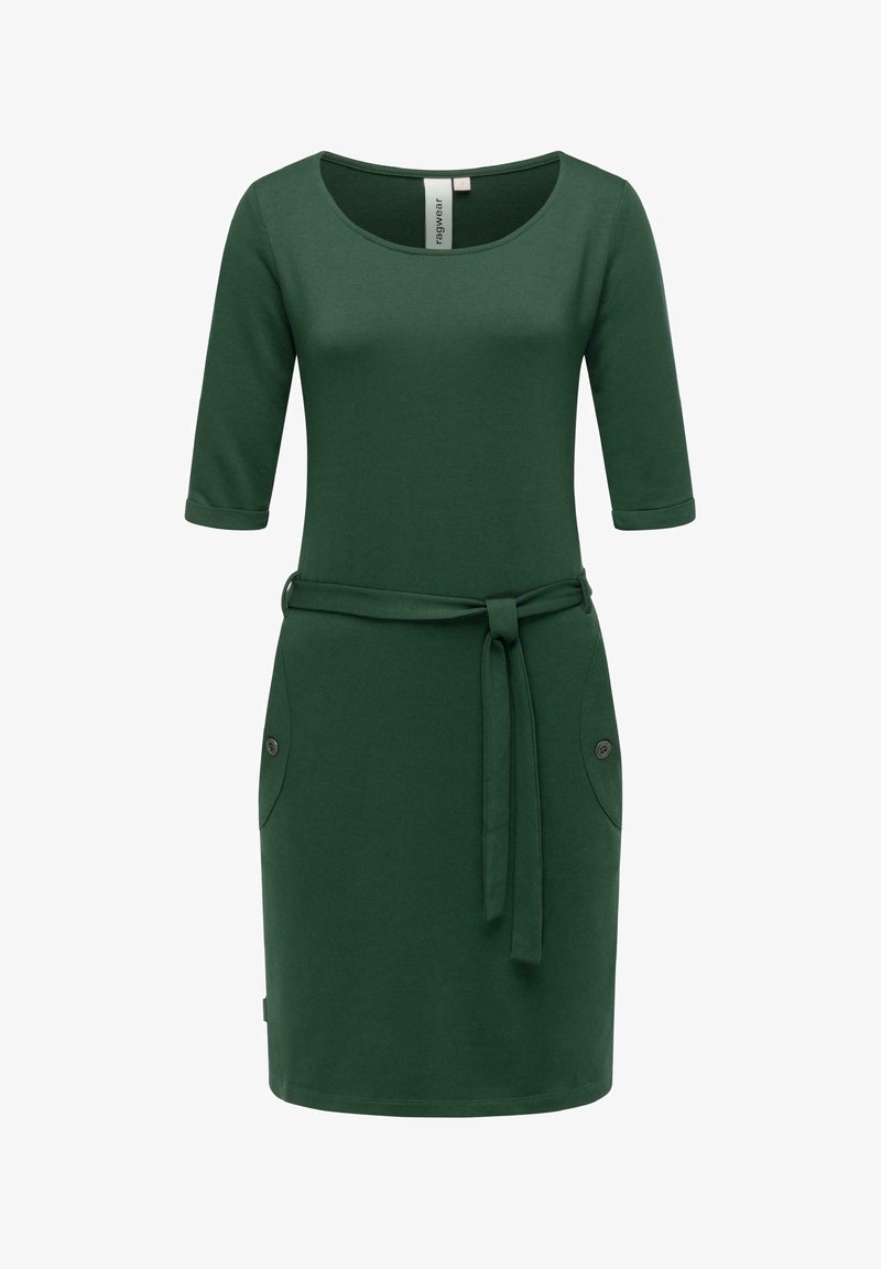 Vihreä mekko pehmeästä kankaasta, jossa on kolme neljäsosaa hihat, pyöreä kaula-aukko, sidottava vyö ja kaksi sivutaskua nappikoruilla.