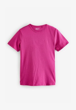 Trumpo rankovės marškiniai ryškiai rožinės spalvos, pagaminti iš minkštos medvilnės audinio. Su apvalia kaklo iškirptele ir paprastu, nepuoštu dizainu.