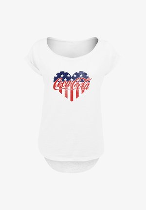 White short-sleeve shirt with a heart-shaped American flag design and red Coca-Cola logo centered on the chest.