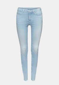Lyseblå skinny jeans lavet af denim, med et klassisk fem-lomme design, bæltestropper og lynlås med knappelukning.