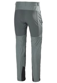 Šedé turistické kalhoty s tapered designem, vybavené zesílenými koleny, bočními kapsami a kombinací matných a lesklých textur.