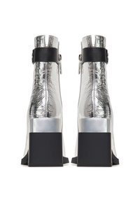 Silver metallic ankle boots with a textured finish, featuring a black strap and block heel. Back zipper closure and wide heel base.